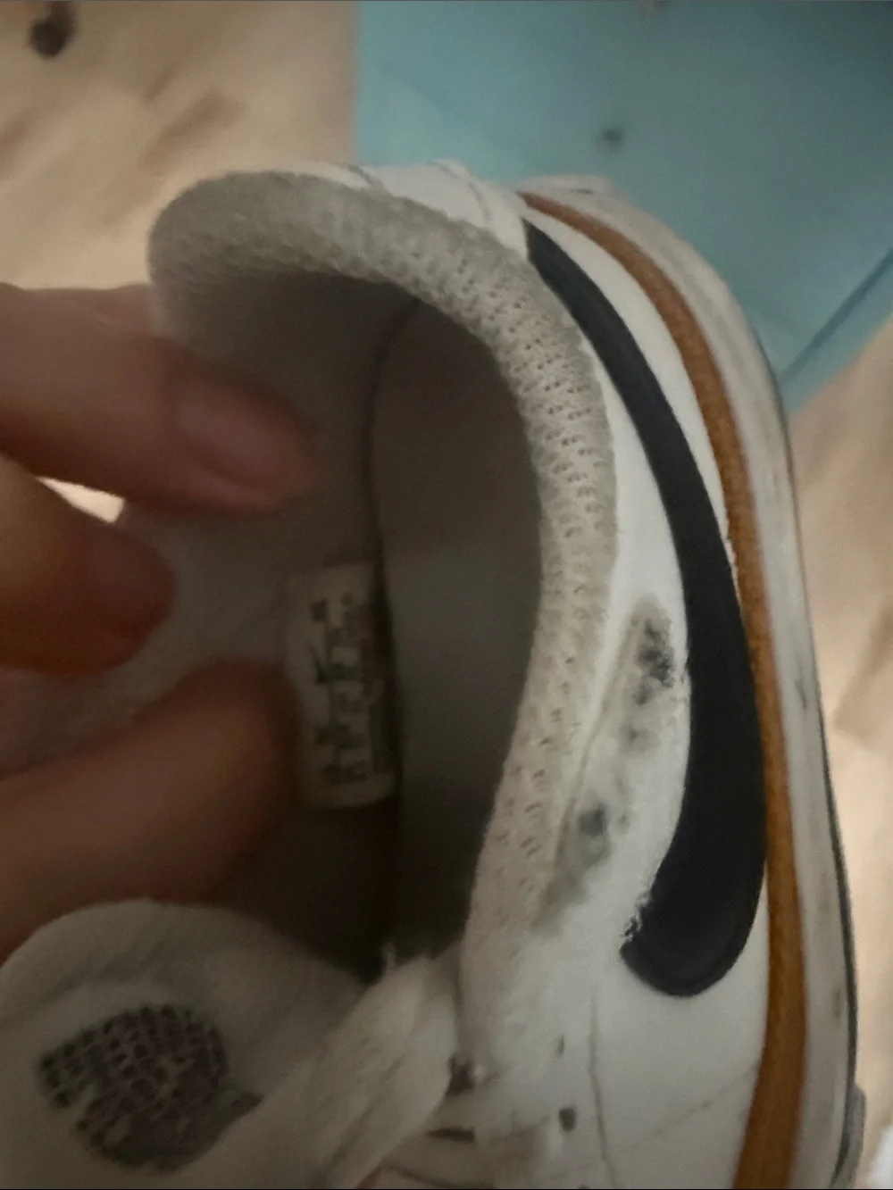 Nike Kids White Sneakers with Black Swoosh and Brown Trim